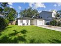 Charming home featuring a well-manicured lawn and cozy front patio seating at 206 N Beverly Ave # 1/2, Tampa, FL 33609