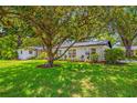 Charming single-story home with well-manicured lawn and mature trees providing ample shade at 2308 Cape Bend Ave, Tampa, FL 33613