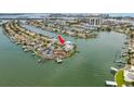Panoramic aerial view of waterfront home with boat docks on a scenic peninsula at 442 Midway Is, Clearwater Beach, FL 33767