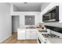 Bright kitchen features white appliances, laminate countertops, and tile floors at 547 Summer Sails Dr, Valrico, FL 33594