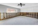 Large, bright space with window and concrete flooring, ready for customization at 7400 Locust Ne St, St Petersburg, FL 33702