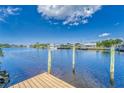 View of the waterway from a wooden dock, featuring boat access and serene water views at 805 Leisey Cir, Ruskin, FL 33570