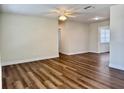 Spacious living room with modern laminate flooring and recessed lighting creates an inviting atmosphere at 14230 86Th Ter, Seminole, FL 33776