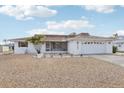 Single-story home with a well-maintained front yard, a screened porch, and an attached two-car garage at 1732 Flamingo Ln, Sun City Center, FL 33573
