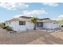 This single-story home has a well-maintained front yard, a screened porch, and an attached two-car garage at 1732 Flamingo Ln, Sun City Center, FL 33573