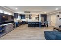 Living room with an open floor plan with kitchen, tile floors, and ample natural light at 1800 Pine St, Clearwater, FL 33764