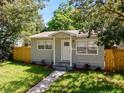 Lovely home with a cozy front porch and manicured landscaping enhancing its curb appeal at 1924 48Th S St, St Petersburg, FL 33711