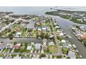 Stunning aerial view of a waterfront home in a picturesque canal community at 4503 Jacona Dr, Hernando Beach, FL 34607