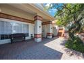Charming entryway with brick flooring, decorative columns, and ample space for seating at 512 Crystal Grove Blvd, Lutz, FL 33548