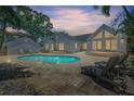 Inviting backyard with a private pool, brick patio, and ample space for lounging and entertaining at 555 21St Ne Ave, St Petersburg, FL 33704