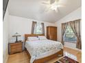 Cozy main bedroom with hardwood floors, ample natural light, and neutral tones at 5908 Mohr Rd, Tampa, FL 33615