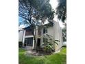 Exterior apartment view showcasing a balcony and screened-in patio at 8636 Tahoe Ct # 13, Tampa, FL 33614