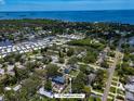Panoramic aerial view of a neighborhood, showcasing the property's proximity to the water at 132 Pennsylvania Ave, Palm Harbor, FL 34683