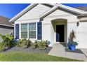 Close up of the home's front exterior, showing the door and front window at 1332 Ocean Spray Dr, Ruskin, FL 33570