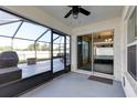 Enclosed patio with ceiling fan and sliding glass doors, perfect for entertaining at 1332 Ocean Spray Dr, Ruskin, FL 33570
