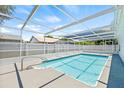 Enjoy the outdoors in this enclosed swimming pool and patio area, perfect for entertaining or relaxing at 1901 76Th N Ave, St Petersburg, FL 33702