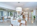 Bright, airy dining area and kitchen featuring stainless steel appliances and an open layout perfect for entertaining at 2201 Horan S Way, Gulfport, FL 33707