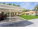 Well-maintained condo featuring covered parking and manicured landscaping, creating an inviting curb appeal at 2460 Northside Dr # 708, Clearwater, FL 33761