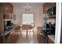 This kitchen features stainless steel appliances, ample counter space, and a sunny breakfast nook at 3200 Cove Cay Dr # 5F, Clearwater, FL 33760