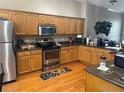 Bright kitchen featuring stainless steel appliances and wood cabinetry at 8405 Costa Bella Way, Temple Terrace, FL 33637