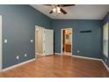 Spacious bedroom has laminate floors, with attached bathroom and closet at 9630 Carlsdale Dr, Riverview, FL 33578