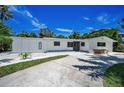 Charming single story home with well-maintained landscaping and a concrete driveway at 112 Peterson Ln, Palm Harbor, FL 34683