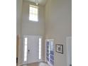 Bright foyer with soaring ceilings, a tiled floor, and a white front door with sidelights at 11408 Scribner Station Ln, Lithia, FL 33547