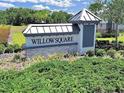 Willow Square community sign surrounded by manicured landscaping at 1674 Roseville St, Lutz, FL 33549