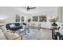Bright living room with sleek flooring, modern furniture, and natural light, offering a cozy and stylish space at 2900 45Th S St # 26, Gulfport, FL 33711