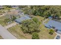 Aerial view of the property highlighting the backyard space, landscaping, and adjacent homes at 3144 Abeline Rd, Spring Hill, FL 34608