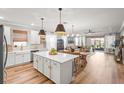 Bright and airy kitchen featuring an island, modern appliances, and a seamless transition to the living area at 4465 Tubular Run, Land O Lakes, FL 34638