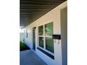 Close-up showcasing the home's freshly painted exterior, modern windows, and updated fixtures at 5627 Commonwealth N Ave, St Petersburg, FL 33703