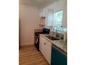 Updated kitchen with granite countertops, stainless steel sink, and newer appliances at 5627 Commonwealth N Ave, St Petersburg, FL 33703