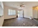 Bright living room with a front door entrance and ample natural light from large windows at 6730 10Th Avenue S Ter, St Petersburg, FL 33707