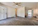 Open living room with neutral walls, ceiling fan, and potential for customization at 6730 10Th Avenue S Ter, St Petersburg, FL 33707
