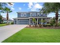 Stunning two-story home boasting lush landscaping and a convenient three-car garage in a desirable neighborhood at 8332 Swiss Chard Cir, Land O Lakes, FL 34637