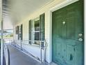 Accessible front entrance features a ramp, dark green door, and complementary window shutters at 9790 66Th N St # 353, Pinellas Park, FL 33782