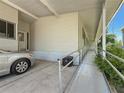 Exterior view of the carport and ramp that leads to the front entrance at 9790 66Th N St # 353, Pinellas Park, FL 33782