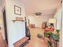 Bright living room with hardwood floors, modern furnishings, and cozy seating at 1972 Briarwood St, Dunedin, FL 34698