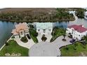 Desirable waterfront home in a prime location with beautifully landscaped grounds and neighboring houses at 3402 Amberjack Dr, Hernando Beach, FL 34607