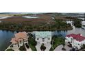 Stunning aerial view of waterfront home, showcasing lush landscaping and prime location at 3402 Amberjack Dr, Hernando Beach, FL 34607