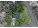 Birds-eye view of home showcasing the property's boundaries and mature landscaping at 34819 Hibiscus Dr, Dade City, FL 33523