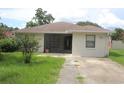 Charming single-story home with a well-maintained lawn and neutral-colored exterior at 38668 Ferm Cir, Zephyrhills, FL 33540
