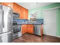 Bright kitchen features stainless steel appliances, including a refrigerator, microwave, oven, and dishwasher at 487 49Th N Ave, St Petersburg, FL 33703