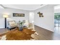 Cozy living room with stylish decor, hardwood floors, and plenty of natural light at 610 Cordova Ne Blvd, St Petersburg, FL 33704