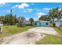 Inviting single-story house boasts a quaint fenced yard and long driveway, perfect for parking at 6704 70Th N Ave, Pinellas Park, FL 33781