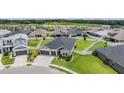 Expansive aerial view showcasing a well-maintained lawn and landscaping at 6879 Talamore Dr, Wesley Chapel, FL 33545