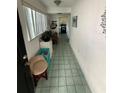 Inviting foyer with tile floors leading to the kitchen and living area at 102 47Th Avenue W Dr # 136, Bradenton, FL 34207
