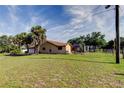 Spacious backyard with a screened-in porch, perfect for outdoor relaxation and entertainment at 10365 Lynnhaven Rd, Spring Hill, FL 34608
