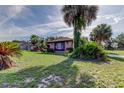 Single-story home with mature landscaping, providing shade and privacy at 10365 Lynnhaven Rd, Spring Hill, FL 34608